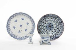 A DELFTWARE STRAINER MID-18TH CENTURY blue painted with a starburst inside a scrolling and trellis
