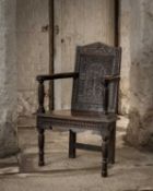 An early 17th century oak caquetoire open armchair, Salisbury, circa 1620-30 and later