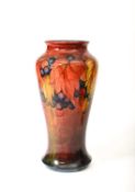 William Moorcroft (1872-1945) for Moorcroft Pottery; A large Flambe Leaf and Berries vase