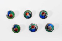 Archibald Knox (1864-1933) for Liberty and Co. A set of six Cymric silver and enamel buttons, 1905