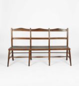 Arts and Crafts, A three seater elm bench, circa 1920.