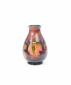 William Moorcroft (1872-1945) for Moorcroft Pottery, A Flambe Leaf and Blackberries vase, circa 1928