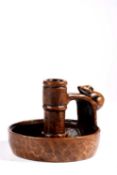 Robert Thompson of Kilburn (1876-1955) A Mouseman chamber candlestick, circa 1940