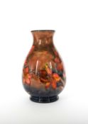 William Moorcroft (1872-1945) for Moorcroft Pottery; A rare copper Flambe Freescia vase or lamp base