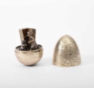 Stuart Devlin (1931-2018) A silver and silver gilt surprise egg, Old Mother Hubbard, London 1983