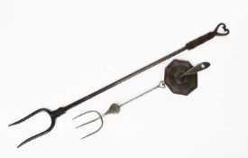 In the manner of Ernest Gimson (1864-1919) A Cotswold School wrought steel toasting fork