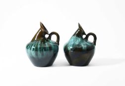 Christopher Dresser (1834-1904) for Linthorpe Pottery, A pair of ewers