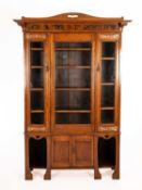 Attributed to Liberty and Co. An Arts and Crafts bookcase, circa 1910