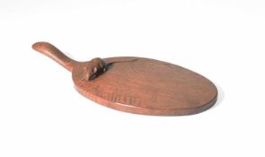 Robert Thompson of Kilburn (1876-1955) An early Mouseman cheeseboard, circa 1940