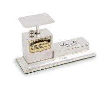 A silver stamp box and letter scale,