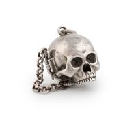 A 17th century silver skull pomander,
