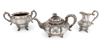 λ A matched George IV and Victorian silver three-piece tea set,