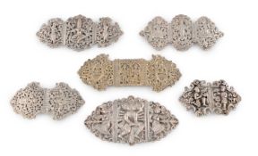 A collection of six late-19th/early-20th century Indian silver nurses' buckles,