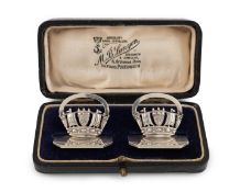 A cased pair of silver menu card holders,
