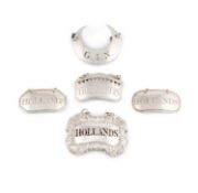 A collection of antique silver wine labels,