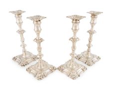 A set of four George II silver candlesticks,
