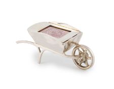 An Edwardian novelty silver wheelbarrow stamp case,