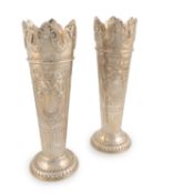 A pair of silver vases,