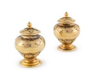 A pair of silver-gilt miniature ginger jars,