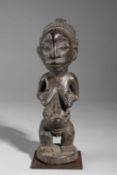 A LUBA STANDING FEMALE FIGURE