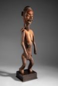 A YAKA-SUKU STANDING FEMALE FIGURE