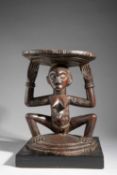 A LUBA CARYATID STOOL