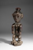 A BOYO STANDING MALE FIGURE