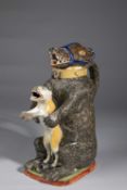 A PEARLWARE BEAR JUG AND COVER