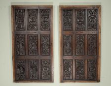 A PAIR OF CARVED OAK PANELS