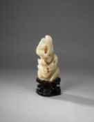 A CHINESE PALE CELADON JADE 'MOUNTAIN' CARVING, QING DYNASTY