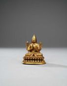 A SMALL TIBETAN GILT-BRONZE FIGURE OF TSONGKHAPA