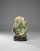 A CHINESE CELADON JADE 'SHOULAO AND MONKEY' MOUNTAIN CARVING