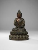 A CHINESE GILT-LACQUERED BRONZE FIGURE OF BUDDHA