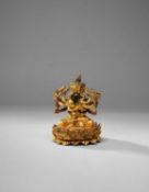 A TIBETAN GILT-BRONZE FIGURE OF GUHYASAMAJA AKSHOBHYAVAJRA