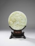 A CHINESE CELADON JADE 'BOYS AND SCHOLARS' CIRCULAR TABLE SCREEN