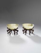 A PAIR OF CHINESE CELADON JADE SHALLOW BOWLS