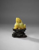 A CHINESE YELLOW JADE CARVING OF A PIXIU