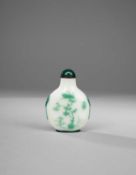 A CHINESE GREEN-OVERLAY GLASS SNUFF BOTTLE