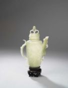 A CHINESE PALE CELADON JADE MUGHAL-STYLE EWER AND COVER