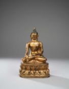 A TIBETAN GILT-BRONZE FIGURE OF BUDDHA