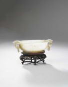 A CHINESE CELADON JADE MUGHAL-STYLE OVAL TWO-HANDLED BOWL