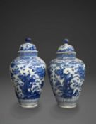 A LARGE PAIR OF JAPANESE ARITA BLUE AND WHITE VASES AND COVERS