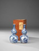 A PAIR OF JAPANESE SHONZUI-STYLE SAKE BOTTLES