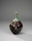 A HUMORISTIC JAPANESE VASE WITH SKELETONS