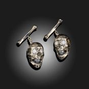 A PAIR OF DIAMOND AND CULTURED PEARL-SET SKULL CUFFLINKS