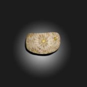 A FOSSILISED SEA URCHIN ARCHERS RING