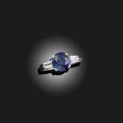 A SAPPHIRE AND DIAMOND THREE STONE RING