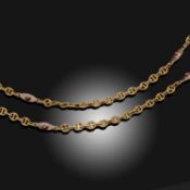 A GARNET-SET GOLD LONG CHAIN