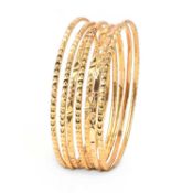A COLLECTION OF SEVEN YELLOW GOLD BANGLES