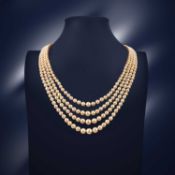 A FOUR ROW NATURAL PEARL NECKLACE